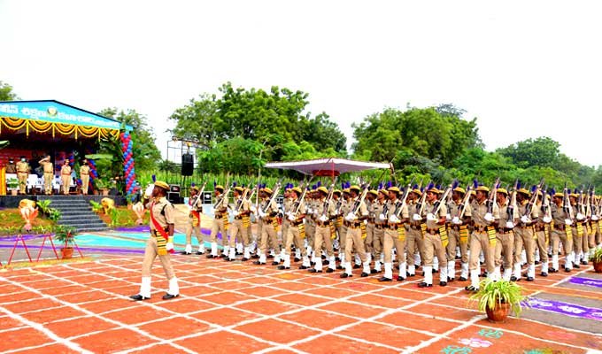 Trained policemen saluting in the parade
